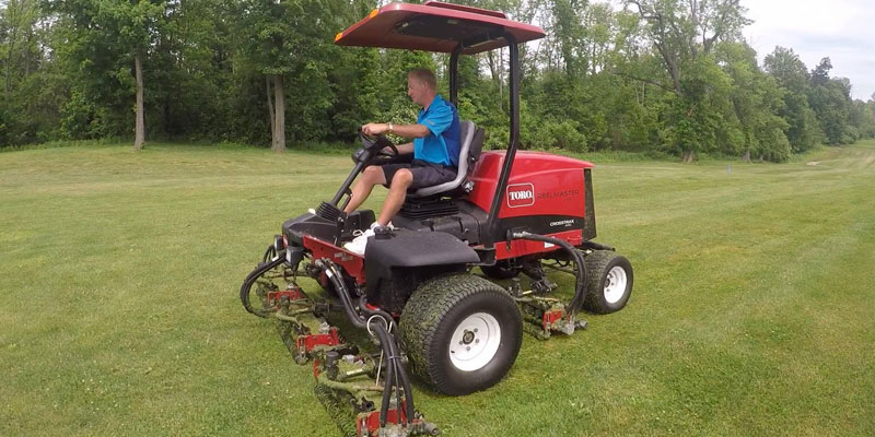 Photo of John Lawton mowing #18 fairway