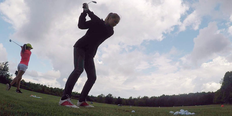 Photo of golf lessons on the range.