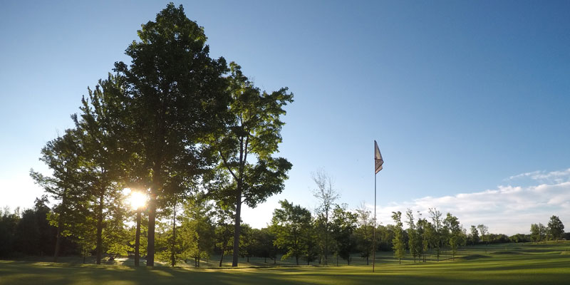 Photo of Par 4 Hole 16 at sunrise at Tamarack Golf Club in Oswego, NY.